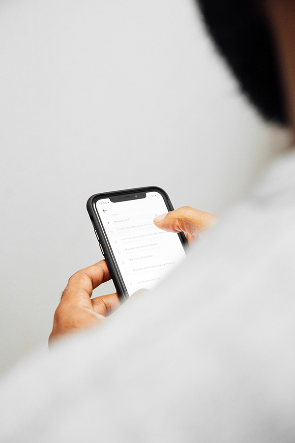 A men is looking on his smartphone.